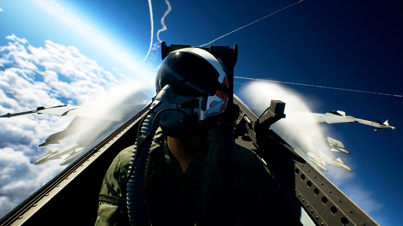 A pilot in the cockpit, helmet and mask on, above bright clouds with another jet off the wing