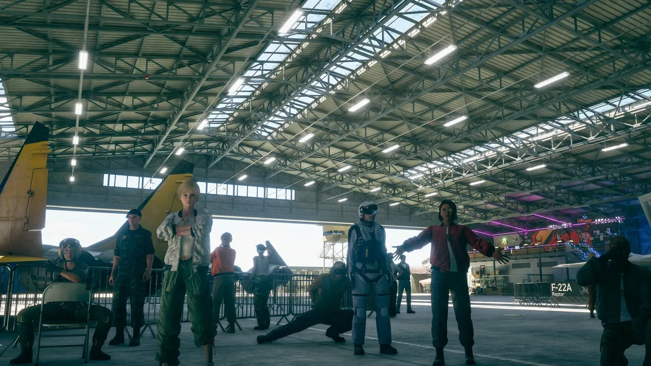 A crowd of pilots and crew gathered inside a hangar in front of parked jets